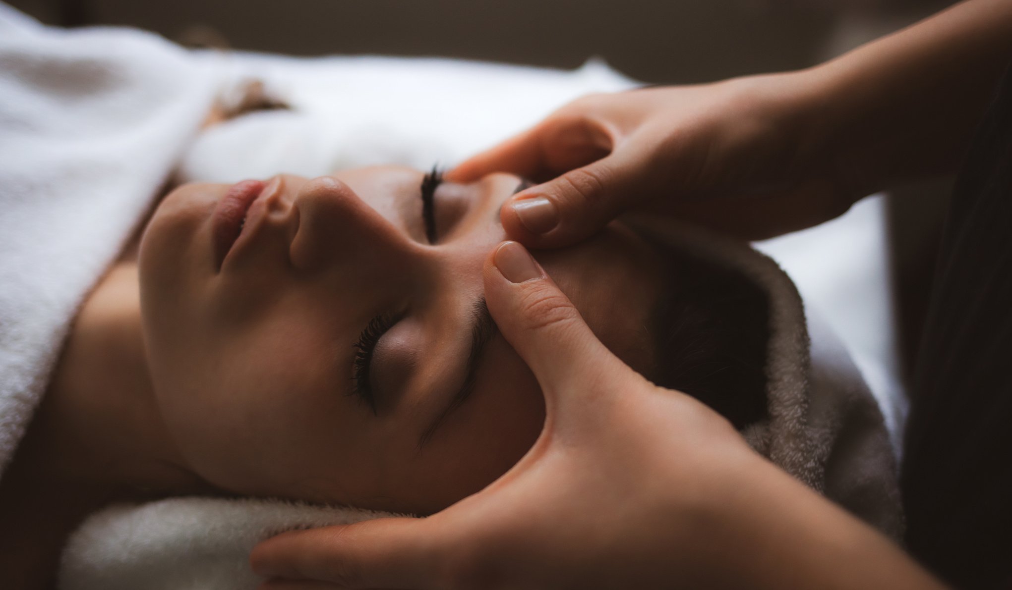 Facial massage at spa.